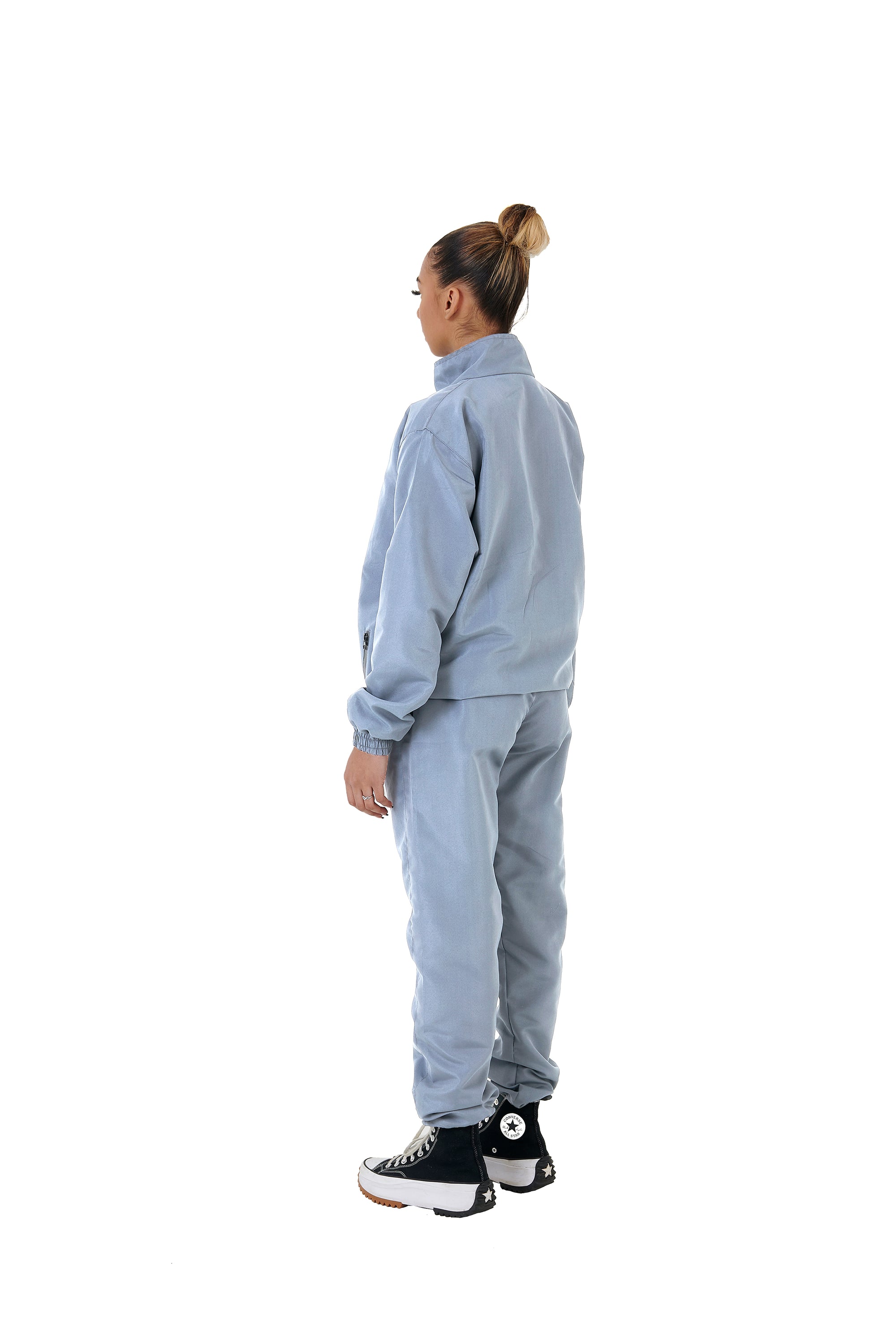 A wholesale supply of oversized nylon jackets with matching oversized nylon joggers is available.