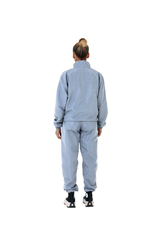 A wholesale supply of oversized nylon jackets with matching oversized nylon joggers is available.