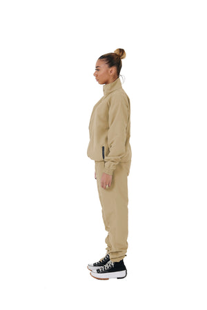 A wholesale supply of oversized nylon jackets with matching oversized nylon joggers is available.