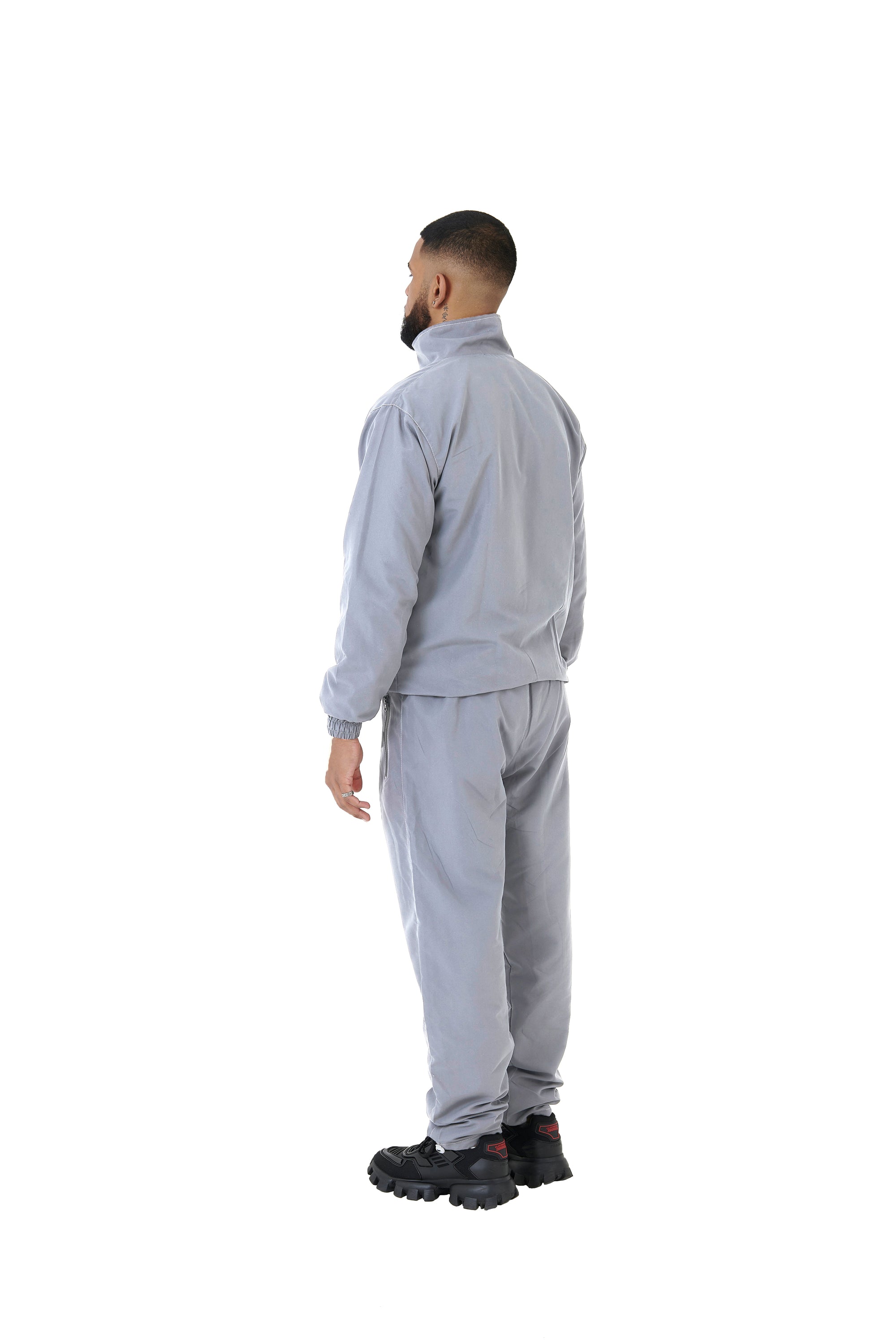 A wholesale supply of oversized nylon jackets with matching oversized nylon joggers is available.